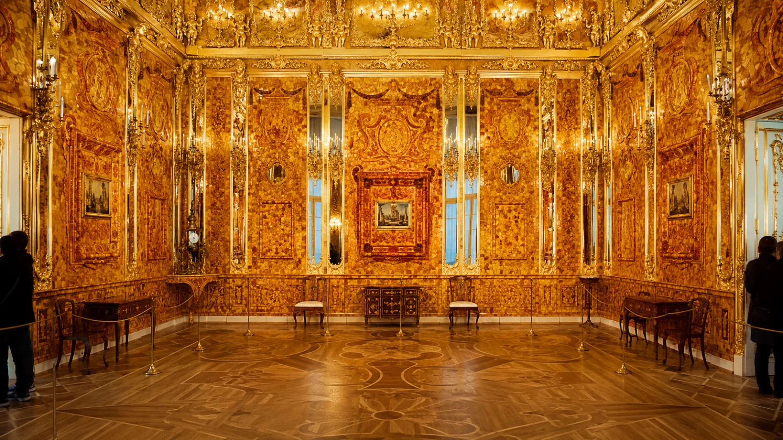 Grand modern interior of the reconstructed Amber Room glowing with polished amber panels and gold trim